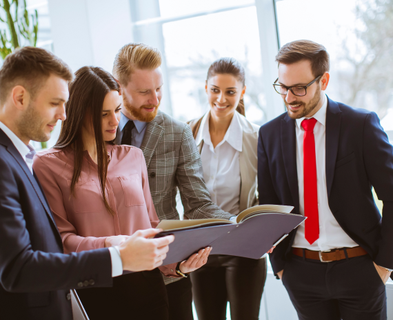 Business coach helping client review performance metrics